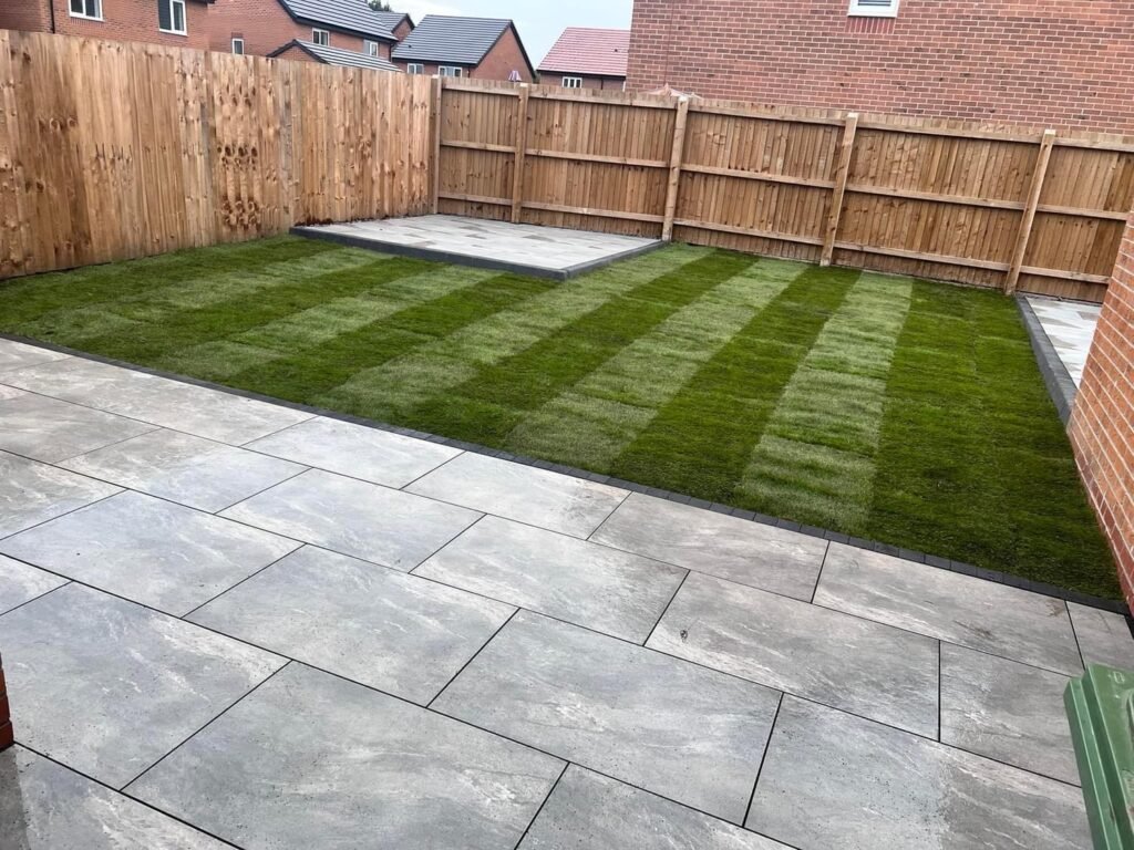 Stripey artificial grass with porcelain tiles
