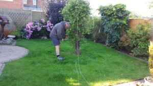 Phil Mc assessing artificial grass job in Heswall before work starts - Artificial Grass Wirral Phil Mc assessing artificial grass job in Heswall before any work starts.